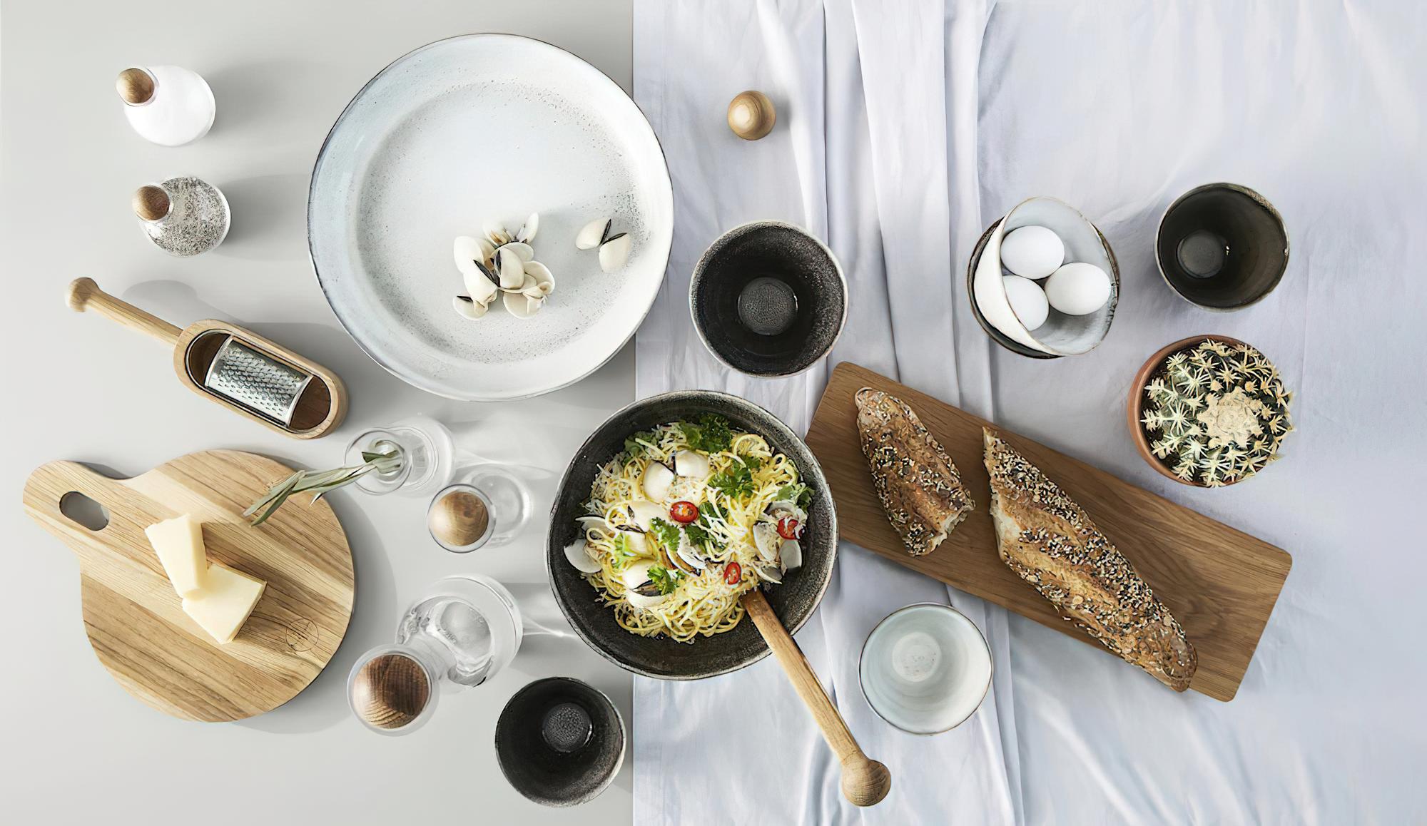 Selection of plated courses laid out on rustic table